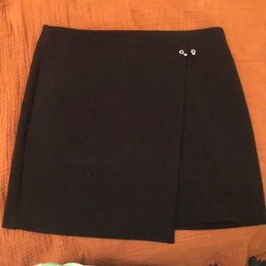Black mini skirt with side bar detail